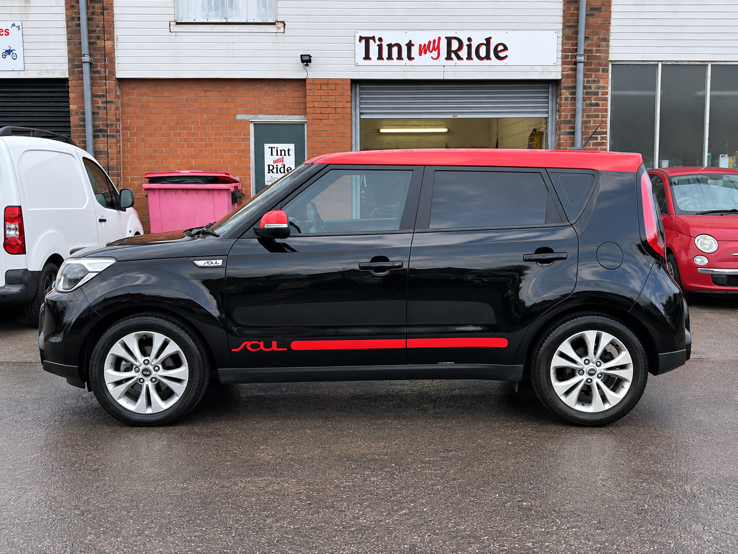 Black Kia Soul with rear window tint