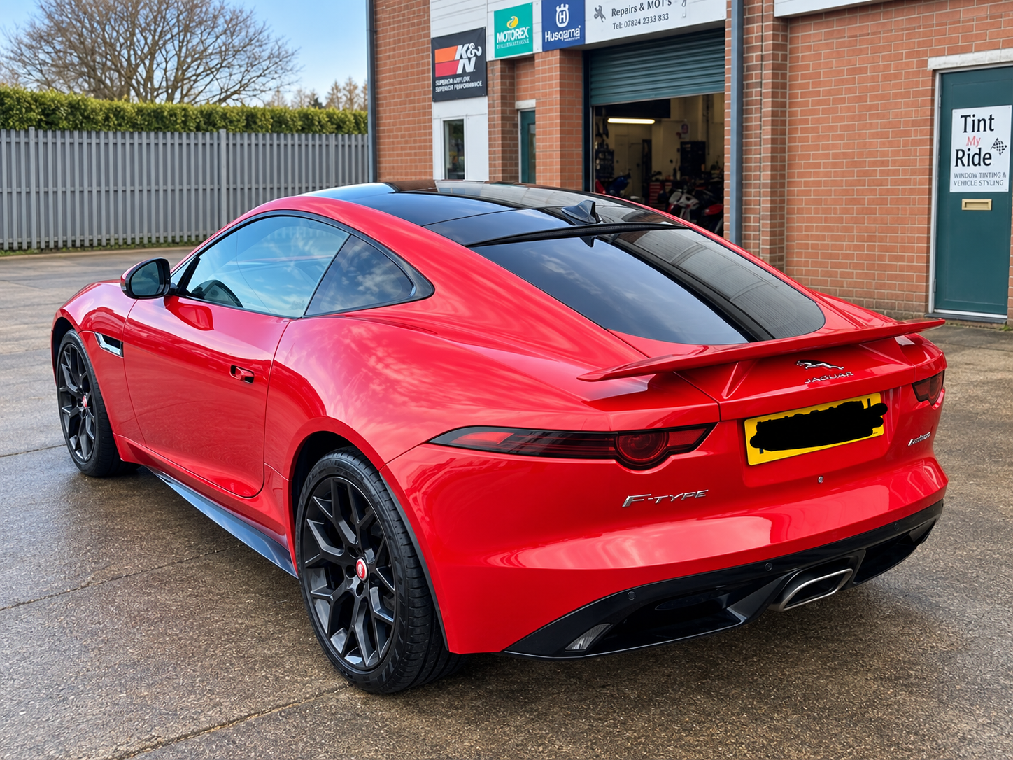 Red Jaguar F-Type with tinted glass