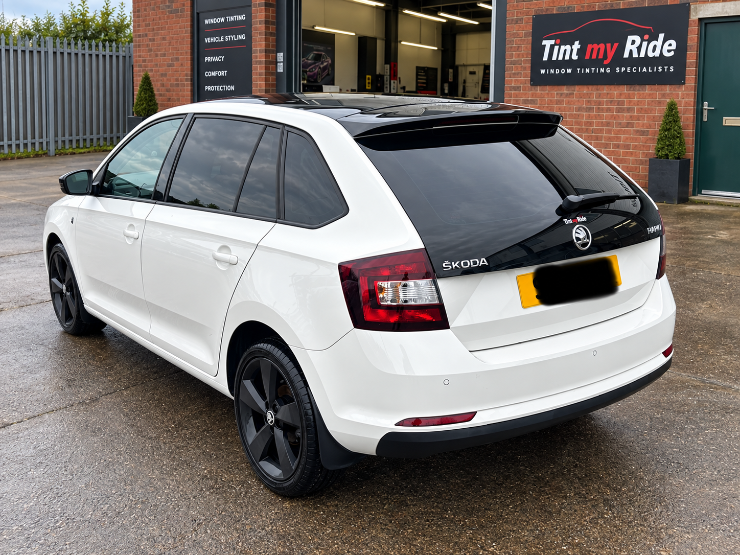White Skoda Rapid Spaceback with tinted rear glass