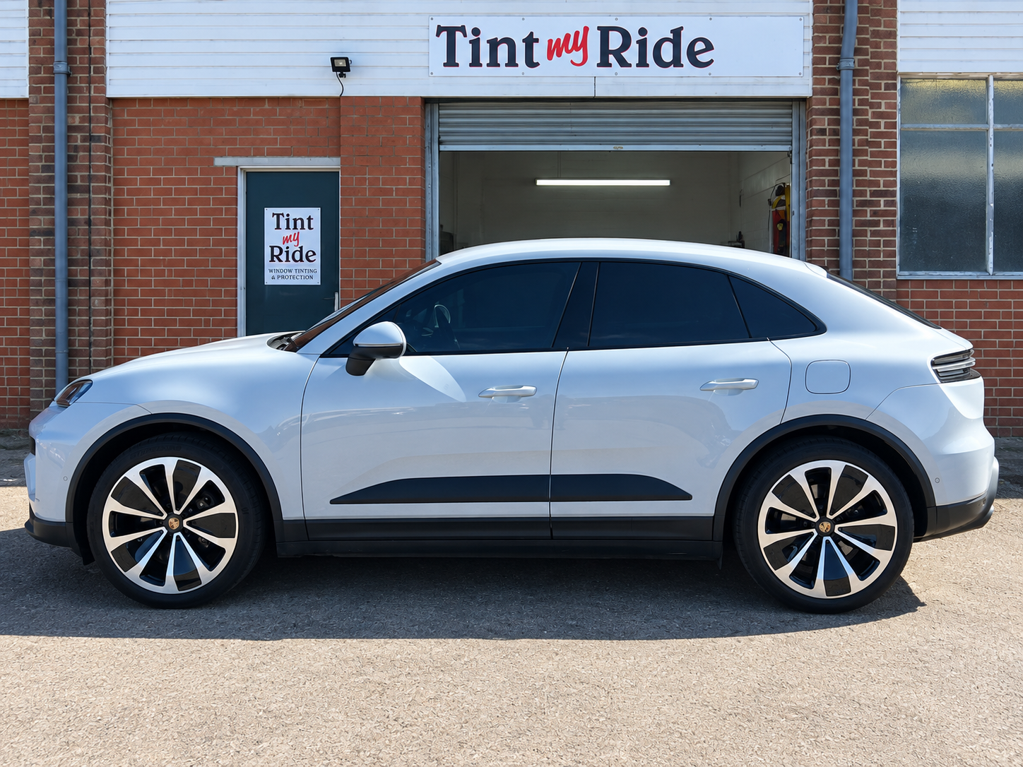 White Porsche Macan with tinted rear windows