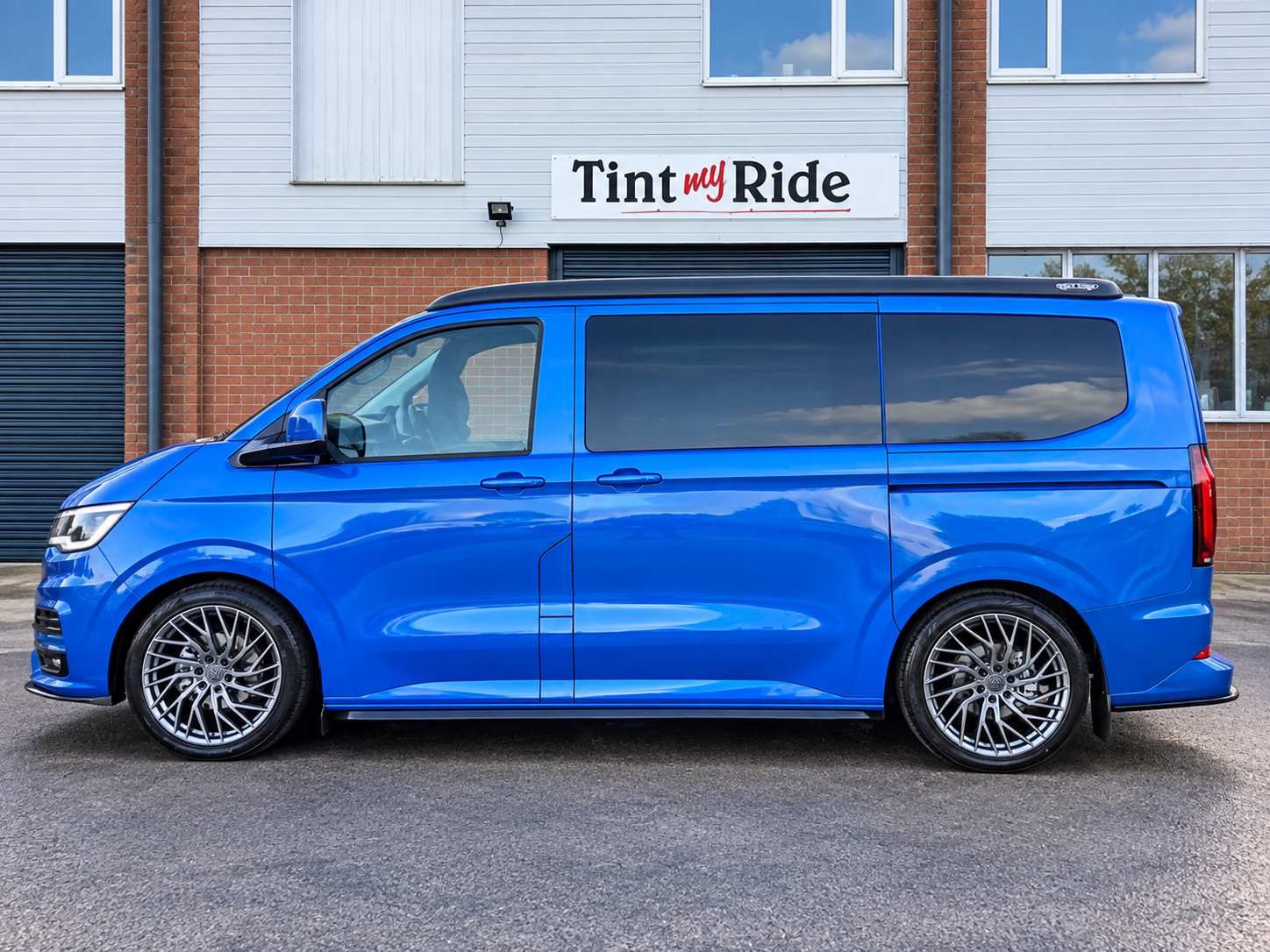 Blue VW camper van with tinted windows