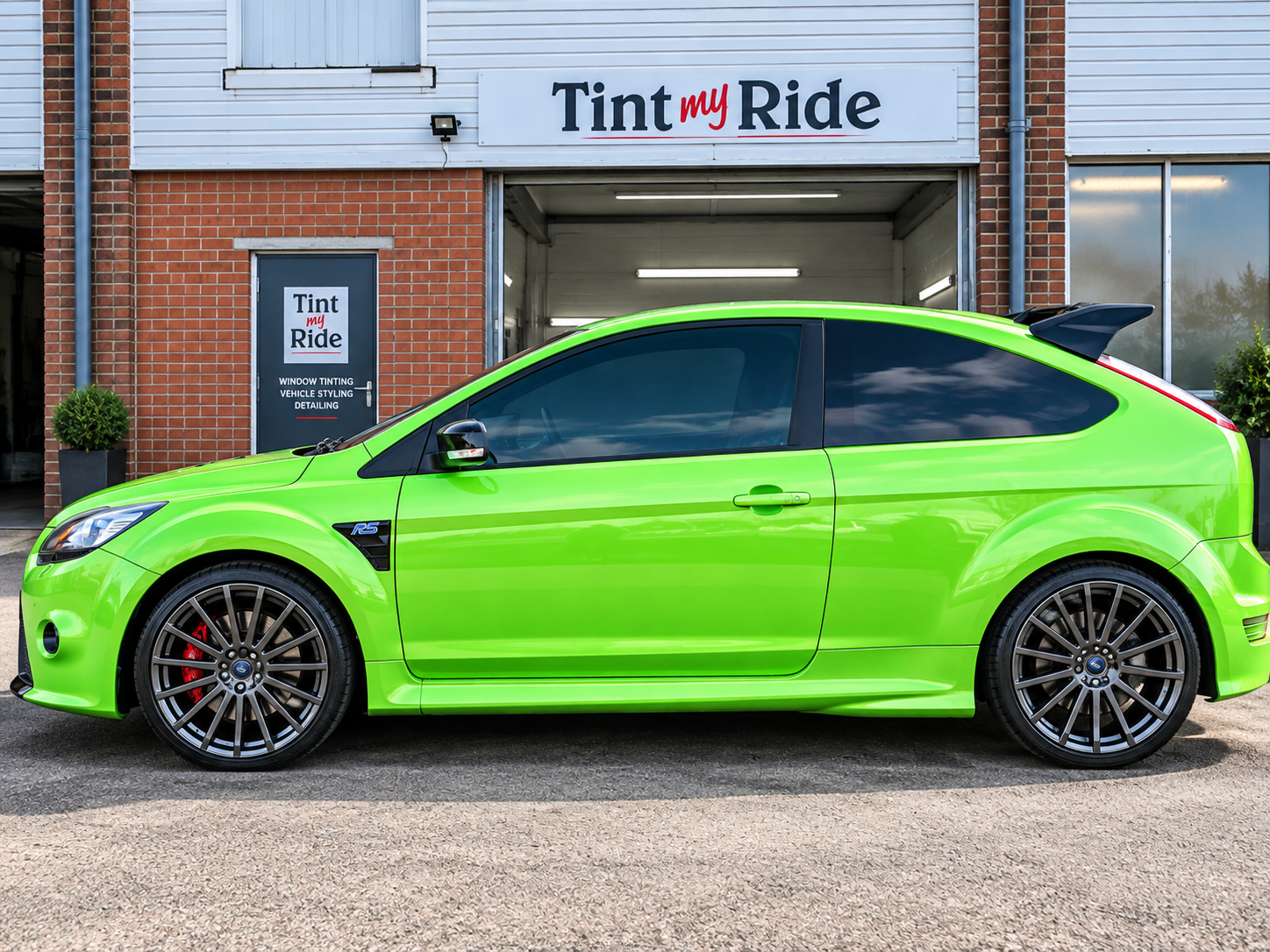 Green performance hatchback with tinted glass