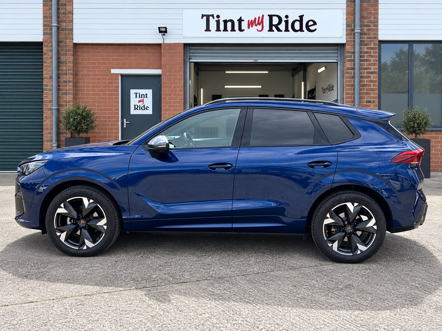 Blue Cupra SUV with tinted rear glass