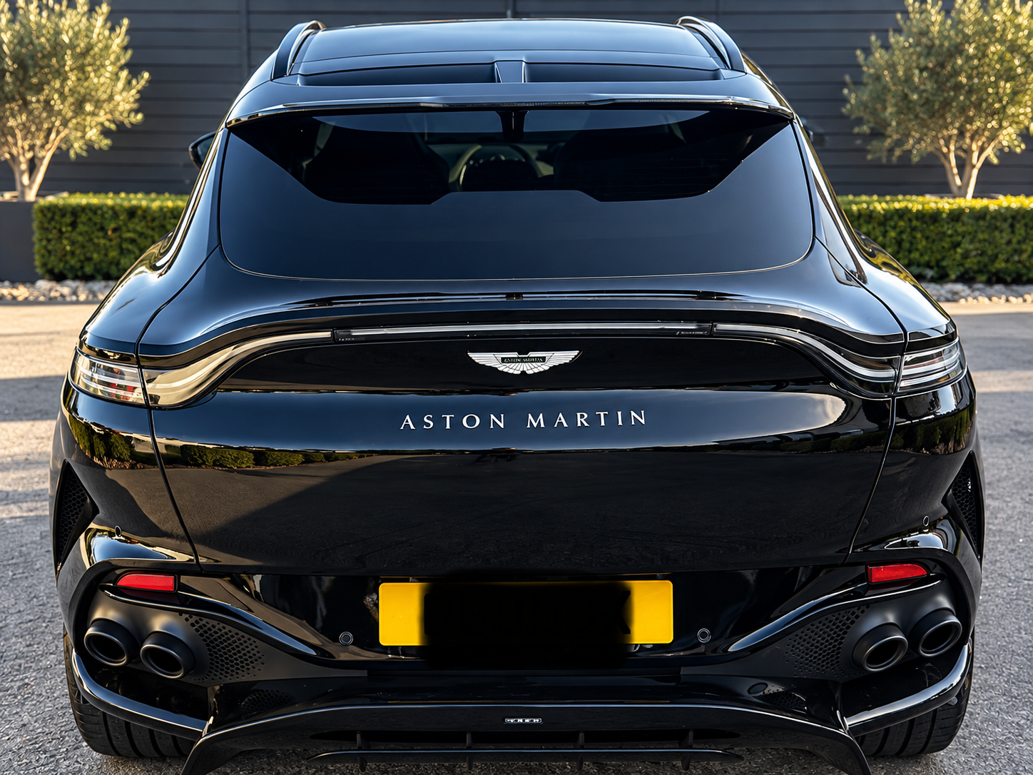 Black Aston Martin DBX with tinted rear screen