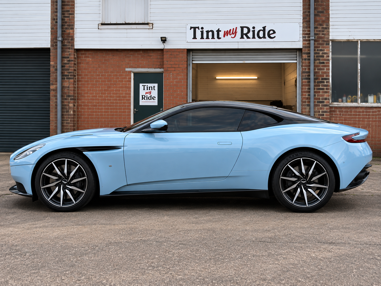 Pale blue Aston Martin DB11 with tinted windows