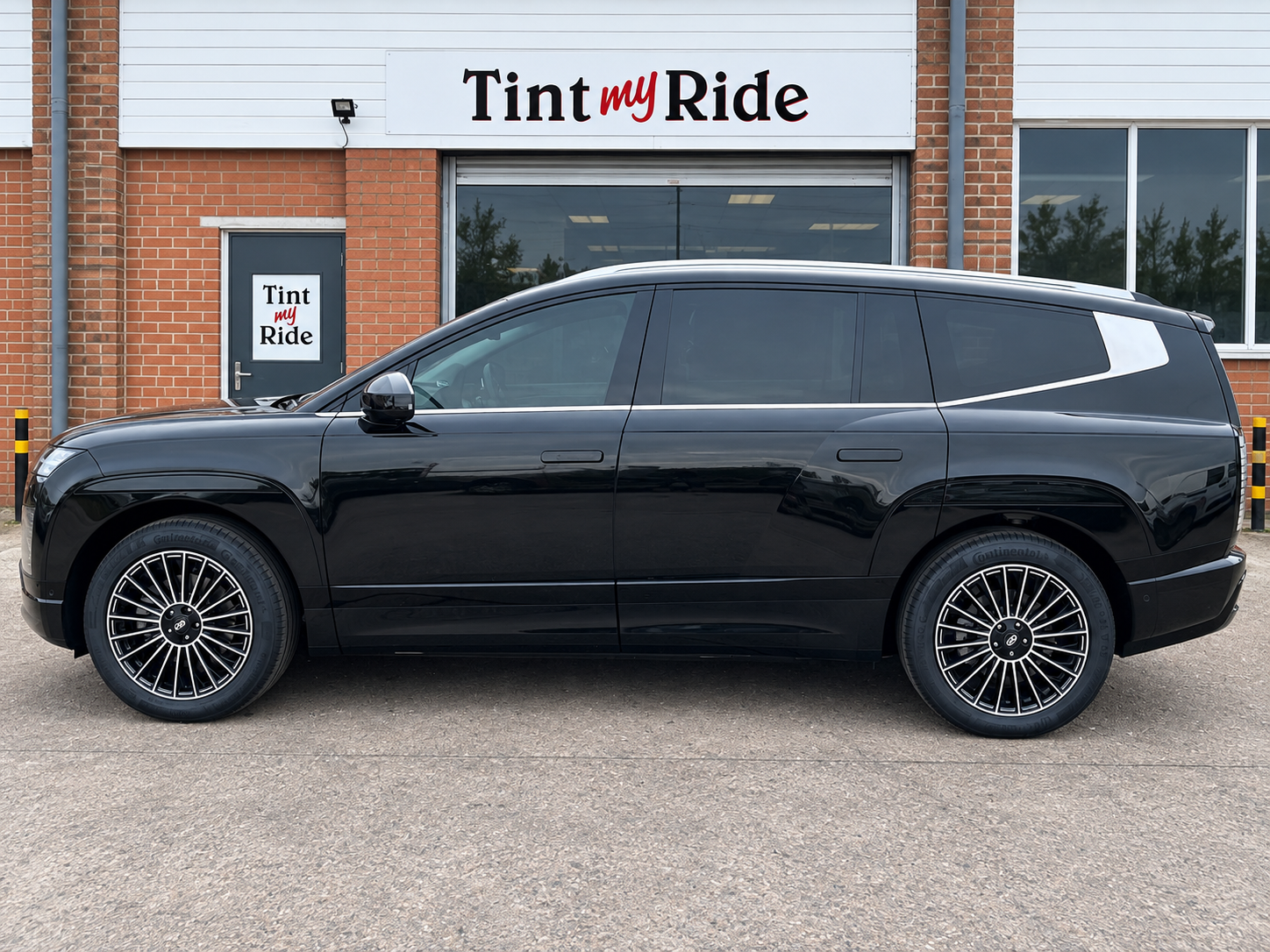 Black SUV with limo black rear tint