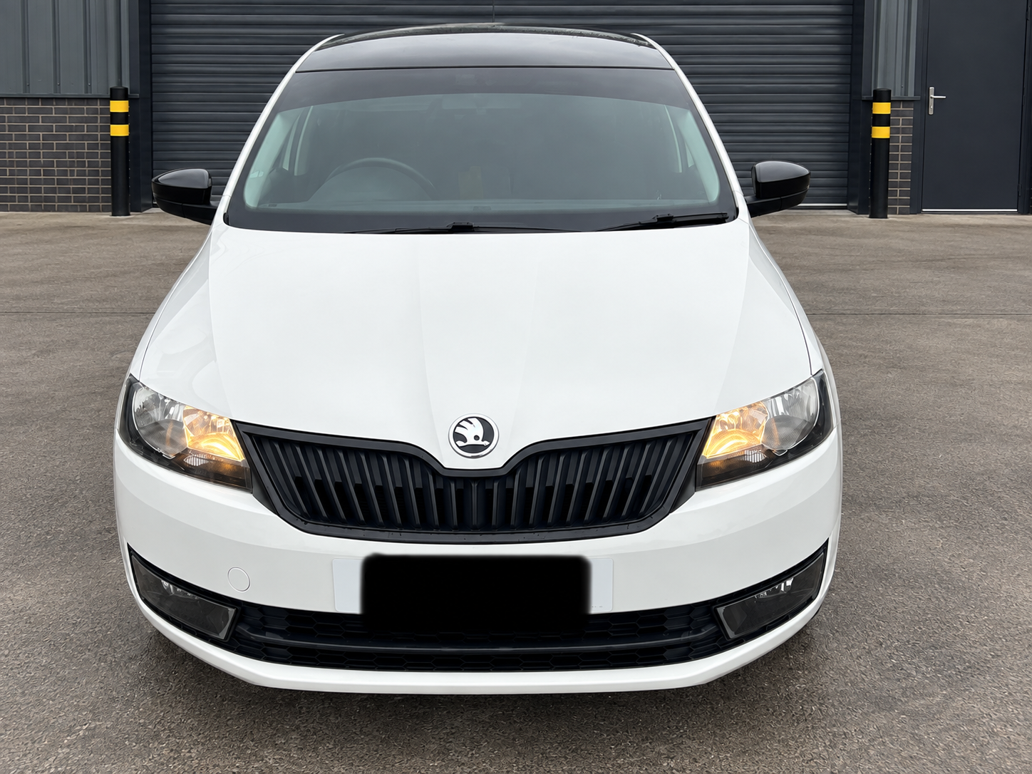 White Skoda with tinted windows